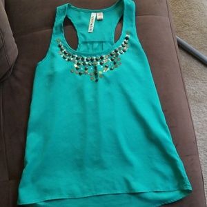 Sold.  Blue green shirt